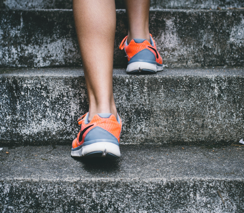 Close-up of someone walking up some steps