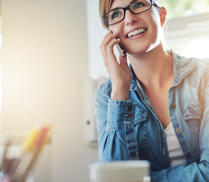 A woman taking on the phone.