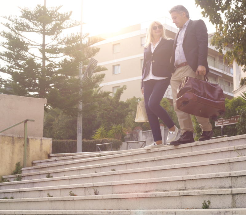 A couple walking down some steps.